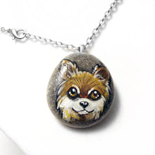 Load image into Gallery viewer, a pendant necklace handmade from a beach rock, hand painted with a dog portrait of a brown and white chihuahua