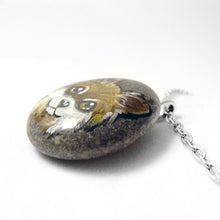 Load image into Gallery viewer, a pendant necklace handmade from a beach rock, hand painted with a dog portrait of a brown and white chihuahua