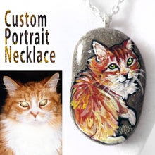 Load image into Gallery viewer, A custom pet portrait necklace, painted on a beach stone of a red, orange, and white long haired tabby cat.
