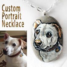 Load image into Gallery viewer, A beach stone is hand painted and crafted into a necklace, customized with a portrait of a white dog