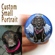 Load image into Gallery viewer, a beach stone personalized with a pet portrait painting of a brown labrador retriever dog as an angel