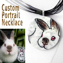 Load image into Gallery viewer, A custom pet portrait painting, on a circle wood necklace, of a brown and white bunny rabbit with red eyes.