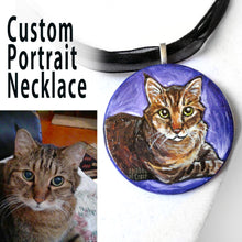 Load image into Gallery viewer, A custom pet portrait painting, on a circle wood necklace, of a brown and orange tabby cat with yellow eyes