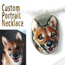 Load image into Gallery viewer, A personalized pet portrait, painted on a small beach stone, of a Shiba Inu dog smiling