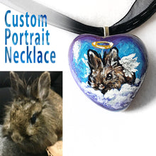 Load image into Gallery viewer, A pendant necklace created from a small beach stone, painted with a portrait of a brown lionhead rabbit as an angel.