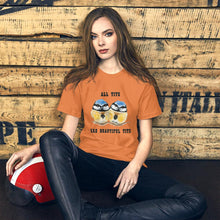 Load image into Gallery viewer, A woman wearing the Beautiful Tits Premium Unisex T-shirt in burnt orange, with art of two blue tit birds, and the words, "all tits are beautiful tits"