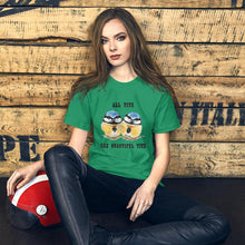 Load image into Gallery viewer, A woman wearing the Beautiful Tits Premium Unisex T-shirt in kelly green, with art of two blue tit birds, and the words, "all tits are beautiful tits"