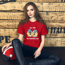 Load image into Gallery viewer, A woman wearing the Beautiful Tits Premium Unisex T-shirt in red, with art of two blue tit birds, and the words, "all tits are beautiful tits"