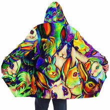 Load image into Gallery viewer, a man wears the bunny lovers rainbow cloak, featuring a bright, all-over rainbow print of different rabbit breeds