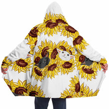 Load image into Gallery viewer, a woman wears a white microfiber fleece cloak (with pockets), printed with sunflower art, with a black cat and white cat peeking out from the flowers