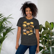 Load image into Gallery viewer, A woman is wearing the Cookie Lovers Unisex Premium T-shirt in the colour dark heather grey, features artwork of 10 different types of cookies.