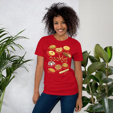 Load image into Gallery viewer, A woman is wearing the Cookie Lovers Unisex Premium T-shirt in the colour  red, with a graphic of 10 different styles of cookies
