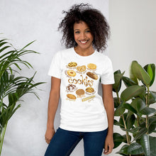 Load image into Gallery viewer, A woman is wearing the Cookie Lovers Unisex Premium T-shirt in the colour white, with a graphic of 10 different types of cookies