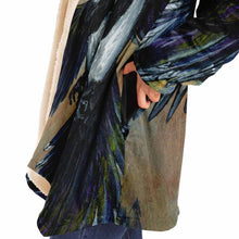 Load image into Gallery viewer, a woman wearing a navy blue and orange cloak, featuring art from the Eight of Cups card, from the Animism Tarot: a magpie, with wings spread, flies up into the night sky.