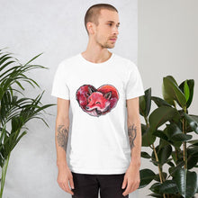 Load image into Gallery viewer, A man is wearing the Fox Love Premium Unisex T-shirt in the colour white, which includes a print of a red fox sleeping in the shape of a heart.