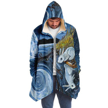 Load image into Gallery viewer, a man wearing the Moon Tarot Cloak, featuring art from the Animism Tarot: a white rabbit looks at the reflection of the moon in the water