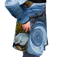Load image into Gallery viewer, a man wearing the Moon Tarot Cloak, featuring art from the Animism Tarot: a white rabbit looks at the reflection of the moon in the water