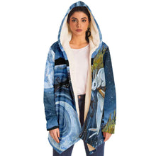 Load image into Gallery viewer, a woman wearing the Moon Tarot Cloak, featuring art from the Animism Tarot: a white rabbit looks at the reflection of the moon in the water