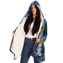Load image into Gallery viewer, a woman wearing the Moon Tarot Cloak, featuring art from the Animism Tarot: a white rabbit looks at the reflection of the moon in the water