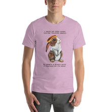 Load image into Gallery viewer, A man wears a unisex t-shirt in the colour heather prism lilac purple, which features an illustration of a bunny rabbit with a pancake on its head. The shirt reads, &quot;I have no idea what you&#39;re talking about / So here&#39;s a bunny with a pancake on its head&quot;
