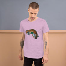 Load image into Gallery viewer, A man is wearing the Platypus Duck Premium T-Shirt in the colour heather prism lilac, which is printed with art of platypus kissing a mallard duck