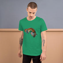 Load image into Gallery viewer, A man is wearing the Platypus Duck Premium T-Shirt in the colour kelly green, which is printed with art of platypus kissing a mallard duck