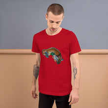 Load image into Gallery viewer, A man is wearing the Platypus Duck Premium T-Shirt in the colour red, which is printed with art of platypus kissing a mallard duck