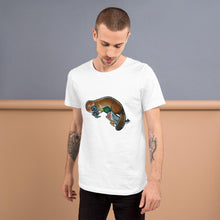 Load image into Gallery viewer, A man is wearing the Platypus Duck Premium T-Shirt in the colour white, which is printed with art of platypus kissing a mallard duck