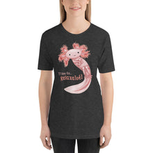 Load image into Gallery viewer, A woman is wearing the Relax Axolotl Unisex Premium T-Shirt in the colour dark grey heather, which includes an image of a smiling pink axolotl, and the words, "Time to.. Relaxalotl"