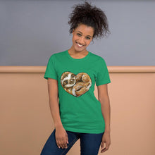 Load image into Gallery viewer, A woman is wearing the Sloth Love Unisex Premium T-Shirt in the colour kelly green, which includes art of a sloth forming the shape of a heart.