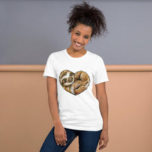 Load image into Gallery viewer, A woman is wearing the Sloth Love Unisex Premium T-Shirt in the colour white, which includes art of a sloth forming the shape of a heart.