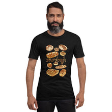Load image into Gallery viewer, A man is wearing the Sourdough Lovers unisex premium t-shirt in the colour black heather, printed with artwork of 10 different sourdough breads.