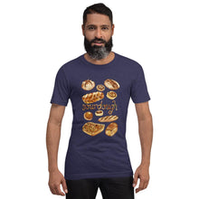 Load image into Gallery viewer, A man is wearing the Sourdough Lovers unisex premium t-shirt in the colour midnight heather, printed with art of 10 different sourdough breads.