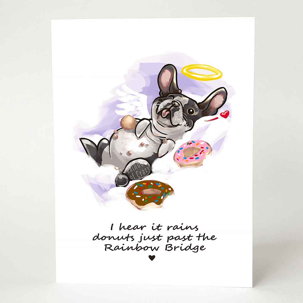 A greeting card with an illustration of a Boston terrier dog angel, lying down with donuts, with the text, 