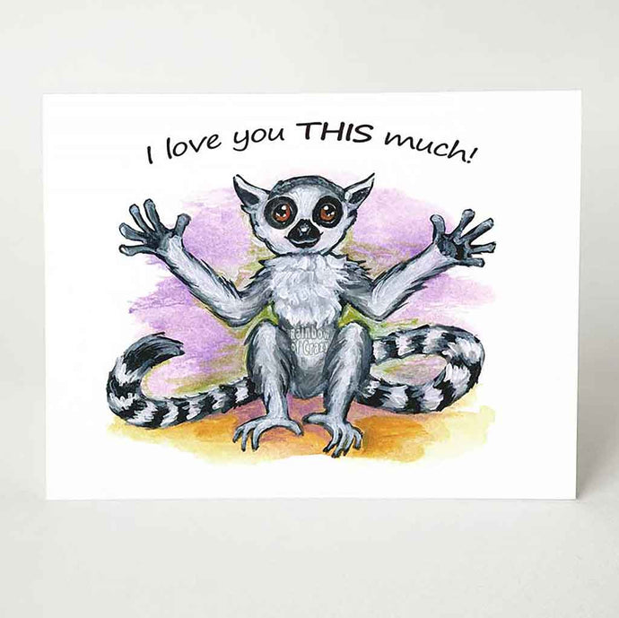 A greeting card, with art of a lemur, arms stretched out, the card reads, 