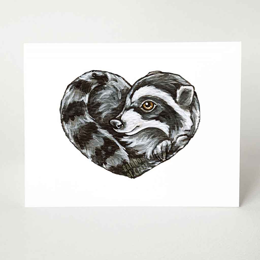 a greeting card featuring an illustration of a raccoon, curled up in the shape of a heart