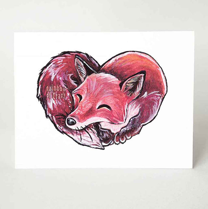 a greeting card with art of a sleeping red fox, forming the shape of a heart