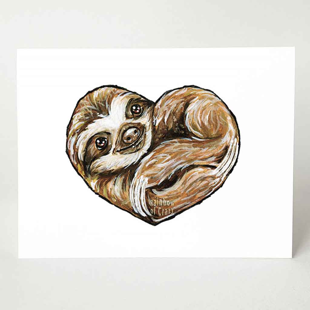A greeting card featuring art of a smiling sloth, curled up in the shape of a heart.