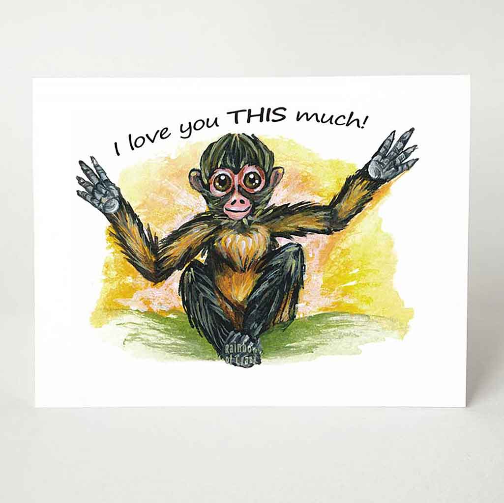 A greeting card with artwork of a spider monkey with its arms spread out wide. The card reads, 