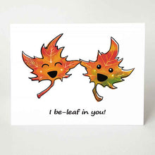 Load image into Gallery viewer, A greeting card with a graphic of two cartoon maple leaves with eyes and smiles, the card reads, &quot;I be-leaf in you!&quot;, a pun on the word &quot;believe&quot;
