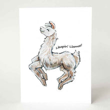 Load image into Gallery viewer, A greeting card, printed with an illustration of a smiling white and brown llama jumping, with the words &quot;Lleapin&#39; Llamas!&quot;
