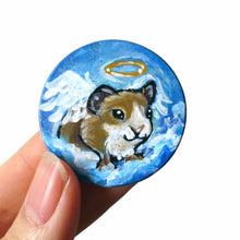 Load image into Gallery viewer, a circle wood disc, painted with a brown and white guinea pig as an angel in the blue cloudy sky
