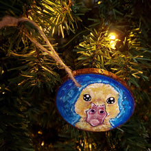 Load image into Gallery viewer, a wood ornament hand painted with a yellow baby duck against a royal blue background
