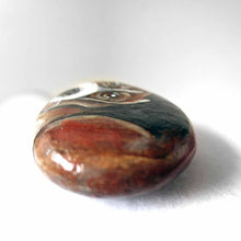 Load image into Gallery viewer, small beach stone hand painted with the portrait of a beagle, compete with paws underneath
