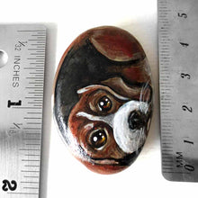 Load image into Gallery viewer, small beach stone hand painted with the portrait of a beagle, compete with paws underneath
