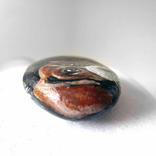 Load image into Gallery viewer, small beach stone hand painted with the portrait of a beagle, compete with paws underneath
