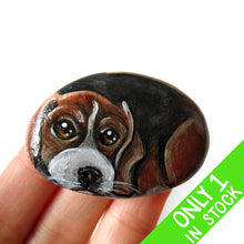 Load image into Gallery viewer, small beach stone hand painted with the portrait of a beagle, compete with paws underneath
