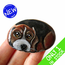 Load image into Gallery viewer, small beach stone hand painted with the portrait of a beagle, compete with paws underneath
