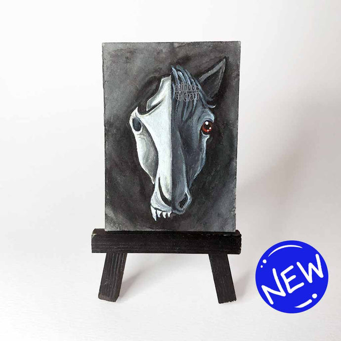 ACEO painting split into two halves: one side featuring a horse skull, and the other a black horse's face