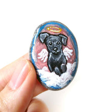 Load image into Gallery viewer, Small rock art of a black labrador retriever dog, painted as an angel, with halo and wings, sitting on clouds. available as a keepsake or pendant necklace
